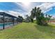 Large backyard with grassy lawn, shed, and pool at 258 Shadow Nw St, Port Charlotte, FL 33952