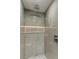 Large walk-in shower with gray marble tile and modern fixtures at 258 Shadow Nw St, Port Charlotte, FL 33952