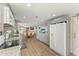 Open kitchen with island, stainless steel appliances, and granite countertops at 258 Shadow Nw St, Port Charlotte, FL 33952