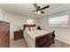 Bedroom with wooden dresser, ceiling fan, and comfortable bed at 258 Shadow Nw St, Port Charlotte, FL 33952