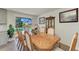 Spacious dining area with wooden table and pool view at 258 Shadow Nw St, Port Charlotte, FL 33952