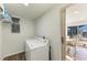 Laundry room with washer, dryer, and additional shelving at 258 Shadow Nw St, Port Charlotte, FL 33952
