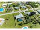 Bird's eye view of house with pool and surrounding neighborhood at 258 Shadow Nw St, Port Charlotte, FL 33952