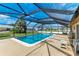 Screened-in pool area with patio furniture at 258 Shadow Nw St, Port Charlotte, FL 33952