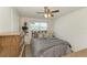 Guest bedroom with ceiling fan and wood-look flooring at 258 Shadow Nw St, Port Charlotte, FL 33952
