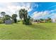 Spacious backyard with shed and grassy lawn at 258 Shadow Nw St, Port Charlotte, FL 33952