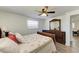 Bedroom with wooden dresser, ceiling fan, and comfortable bed at 258 Shadow Nw St, Port Charlotte, FL 33952