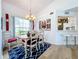 Charming dining room featuring a wooden table, chandelier, and stylish rug at 6568 Fairway Gardens Dr, Bradenton, FL 34203