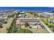 Scenic aerial view of the community by the water featuring a pool and ample parking at 1001 W Marion Ave # 14, Punta Gorda, FL 33950