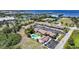 Community aerial view with pool, landscaping, parking, and water views at 1001 W Marion Ave # 14, Punta Gorda, FL 33950