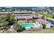 Aerial view showcasing the community pool and well-maintained landscaping near the water at 1001 W Marion Ave # 14, Punta Gorda, FL 33950