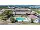 Aerial view showcasing the community pool and well-maintained landscaping near the water at 1001 W Marion Ave # 14, Punta Gorda, FL 33950