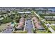 Community aerial view showcasing lush landscaping, ample parking, and a community pool at 1001 W Marion Ave # 14, Punta Gorda, FL 33950