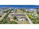 Aerial view of waterfront community featuring a pool, parking, and beautiful landscaping at 1001 W Marion Ave # 14, Punta Gorda, FL 33950