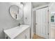 Bathroom with updated vanity, sink, mirror, and lighting at 1001 W Marion Ave # 14, Punta Gorda, FL 33950