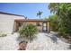 Charming single-story home featuring desert landscaping and a neutral exterior paint scheme on a sunny day at 1001 W Marion Ave # 14, Punta Gorda, FL 33950