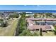 Exterior view of condos with red tile roofs near the waterfront, showing parking and greenery at 1001 W Marion Ave # 14, Punta Gorda, FL 33950