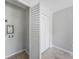 This laundry area includes white bi-fold doors, tile flooring, and hookups for a washer and dryer at 1001 W Marion Ave # 14, Punta Gorda, FL 33950