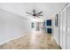Living room with ceiling fan is open to the kitchen and offers a sliding closet with storage space at 1001 W Marion Ave # 14, Punta Gorda, FL 33950