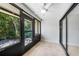 This porch has sliding glass doors and screens leading out to the backyard at 1001 W Marion Ave # 14, Punta Gorda, FL 33950
