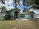 Single story home with lush lawn and tropical landscaping at 269 Rosemary St, Port Charlotte, FL 33954