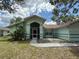 Single story home with lush lawn and tropical landscaping at 269 Rosemary St, Port Charlotte, FL 33954