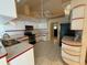 White kitchen featuring tile countertops, a stainless steel oven, and ample cabinet space at 269 Rosemary St, Port Charlotte, FL 33954