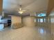 Spacious open-concept living area with tiled floors, a ceiling fan, and ample natural light at 269 Rosemary St, Port Charlotte, FL 33954