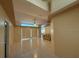 Bright living room with tile flooring, a ceiling fan, and a comfortable couch at 269 Rosemary St, Port Charlotte, FL 33954