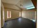 Spacious room with neutral walls, sliding glass door, ceiling fan, and abundant natural light at 269 Rosemary St, Port Charlotte, FL 33954