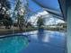 Spacious screened-in pool area with surrounding deck at 269 Rosemary St, Port Charlotte, FL 33954