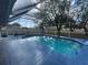 Inviting screened-in pool with a blue tiled deck at 269 Rosemary St, Port Charlotte, FL 33954