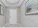 Inviting entryway with neutral walls and a white door at 255 W End Dr # 3211, Punta Gorda, FL 33950