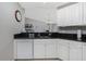 Kitchen boasts granite countertops and white cabinetry at 255 W End Dr # 3211, Punta Gorda, FL 33950