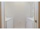 Functional laundry room with washer and dryer, plus shelving at 255 W End Dr # 3211, Punta Gorda, FL 33950