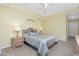 Bright bedroom with king-size bed and ceiling fan at 255 W End Dr # 3211, Punta Gorda, FL 33950