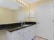 Bathroom features a vanity with granite countertop and large mirror at 255 W End Dr # 3211, Punta Gorda, FL 33950