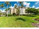 Exterior view of condo building with landscaping at 255 W End Dr # 3211, Punta Gorda, FL 33950