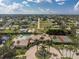 Aerial view of community pool, tennis courts, and clubhouse at 255 W End Dr # 3211, Punta Gorda, FL 33950