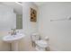 Clean bathroom with pedestal sink, toilet, and shower at 255 W End Dr # 3211, Punta Gorda, FL 33950