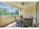 Screened patio with table and chairs, offering outdoor dining space at 255 W End Dr # 3211, Punta Gorda, FL 33950
