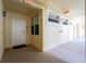 White door entry to condo building with hallway and windows at 255 W End Dr # 3211, Punta Gorda, FL 33950