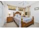 Well-lit bedroom with a wooden bed frame, nightstands, and ample closet space at 255 W End Dr # 3211, Punta Gorda, FL 33950