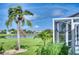 Serene backyard oasis with lush landscaping and tranquil pond views at 7369 Schefflera, Punta Gorda, FL 33955