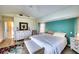 Bright bedroom with a queen bed, dresser, and access to a pool view at 7369 Schefflera, Punta Gorda, FL 33955