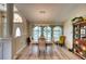 Bright dining room with light wood floors and a charming table set for four at 7369 Schefflera, Punta Gorda, FL 33955