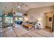 Bright living room with vaulted ceilings, light flooring, and comfy furniture at 7369 Schefflera, Punta Gorda, FL 33955