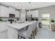 Modern kitchen with island seating and stainless steel appliances at 16844 Lazzo Dr, Port Charlotte, FL 33953