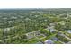 Aerial view showcasing a residential area with houses surrounded by greenery at 17440 Marcy Ave, Port Charlotte, FL 33948