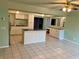 Kitchen features an island and white cabinets at 512 Chamber Nw St, Port Charlotte, FL 33948